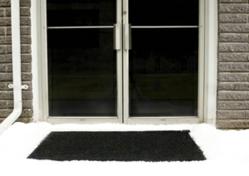 Martinson-Nicholls new Industrial Snow-Melting Entrance Mats are electrically heated carpet mats designed to prevent snow and ice accumulation around building entryways - photo